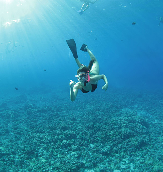 Woman snorkeling on Maui